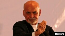 FILE - Afghan president-elect Ashraf Ghani speaks during an event in Kabul, Sept. 22, 2014.