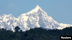 FILE - A view of the Kanchenjunga mountain along the Himalayan mountain range on the frontier between Nepal and Sikkim, March 14, 2005 . The mountain is the third highest in the world at 8,586 meters (28,169 ft) above sea level.