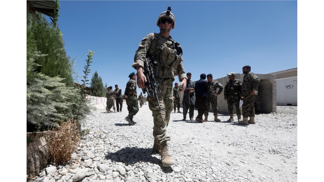 FILE - A U.S. soldier keeps watch at an Afghan National Army (ANA) base in Logar province, Afghanistan, August 5, 2018.