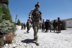 FILE - A U.S. soldier keeps watch at an Afghan National Army (ANA) base in Logar province, Afghanistan, August 5, 2018.