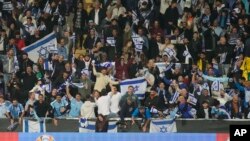 FILE—Israel supporters cheer during the Euro 2024 qualifying play-off soccer match between Israel and Iceland, at Szusza Ferenc Stadium in Budapest, Hungary, March 21, 2024.