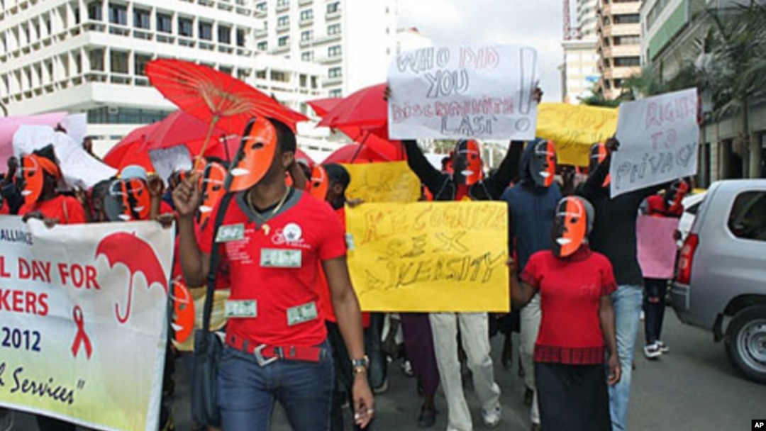 Masked sex workers march through the streets to demand access to government services, in Nairobi, Kenya, March 6, 2012.