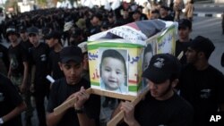 A rescue boat approaches a submerged car on a flooded street after heavy rainfall in Guiyang city, Guizhou province, China.