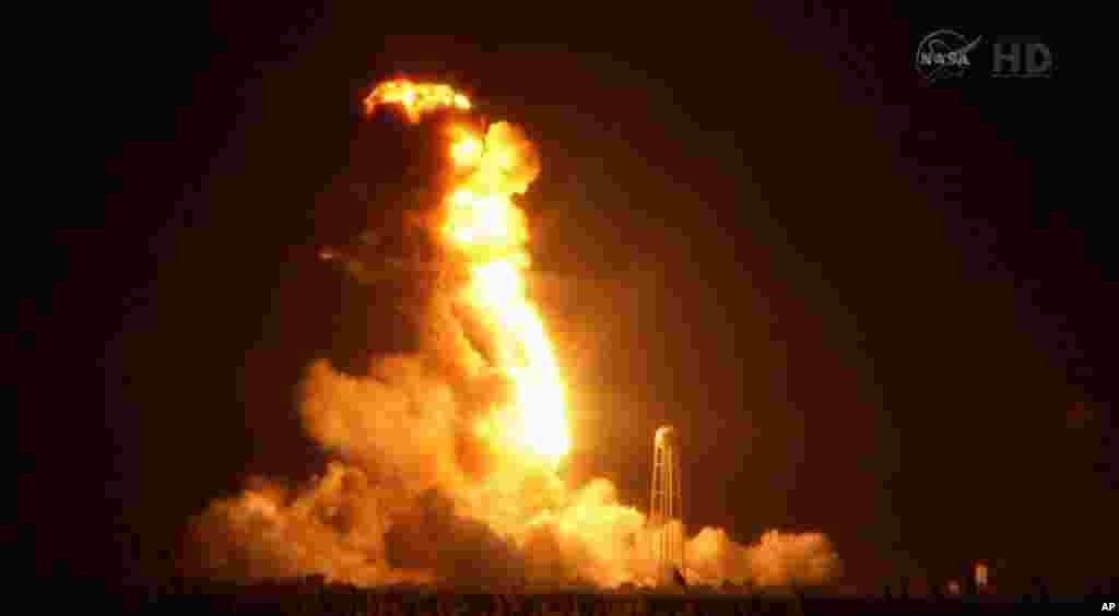 This image taken from video provided by NASA TV shows Orbital Sciences Corp.&#39;s unmanned rocket blowing up over the launch complex at Wallops Island, Va., just six seconds after liftoff. The company says no one was believed to be hurt and the damage appeared to be limited to the facilities, Oct. 28, 2014. 