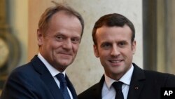 French President Emmanuel Macron (right) welcomes European Council President Donald Tusk at the Elysee presidential Palace in Paris, May 17, 2017.