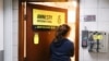 A woman enters the Amnesty International Hong Kong office, after its announcement to close citing China-imposed national security law, in Hong Kong, China Oct. 25, 2021. 