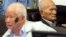 In this photo released by the Extraordinary Chambers in the Courts of Cambodia, Khieu Samphan, left, former Khmer Rouge head of state, and Nuon Chea, right, who was the Khmer Rouge's chief ideologist and No. 2 leader, sit in the court hall before they made closing statements at the U.N.-backed war crimes tribunal in Phnom Penh, file photo. 