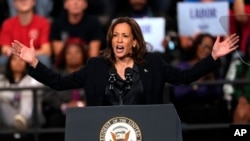 Democratic presidential nominee Vice President Kamala Harris speaks during a campaign rally at the Dort Financial Center in Flint, Michigan, Oct. 4, 2024. 