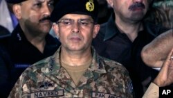 FILE - In this July 26, 2016 photo, Lt. Gen. Naveed Mukhtar attends funeral prayers in Karachi, Pakistan. 