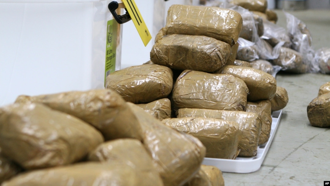 FILE - In this undated photo provided by the Australian Federal Police, packages containing methamphetamine are stacked in a warehouse in Melbourne, Australia.