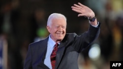 FILE - Former President Jimmy Carter waves to the crowd at the Democratic National Convention 2008 at the Pepsi Center in Denver, Colorado, Aug. 25, 2008. Carter died at the age of 100 on Dec. 24, 2024.