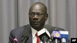 FILE - South Sudan's Information Minister Michael Makuei attends a press conference in Addis Ababa, Ethiopia, Jan. 5, 2014. The Trump administration, on Sept. 6, 2017, imposed sanctions on Makuei, another senior member of South Sudan's government, a former official, and three South Sudanese companies for undermining peace, security and stability in the crisis-stricken nation.