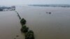 An aerial view shows the swollen Yangtze River in Jiujiang, in China's central Jiangxi province, on July 17, 2020.