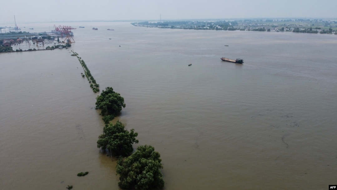 An aerial view shows the swollen Yangtze River in Jiujiang, in China's central Jiangxi province, on July 17, 2020.