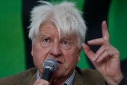 FILE - Stanley Johnson, father of the British Prime Minister Boris Johnson, speaks at an event on climate change, in London, Oct. 9, 2019.
