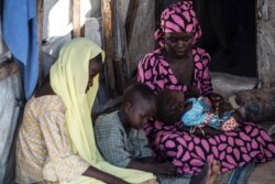 Aishatu Bulama has been reunited with her children, in Maiduguri, Nigeria. (C. Oduah/VOA)