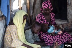 Aishatu Bulama has been reunited with her children, in Maiduguri, Nigeria. (C. Oduah/VOA)