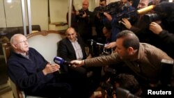 Former Lebanese information minister Michel Samaha (L) speaks to the media at his home after being released in Beirut, Lebanon, Jan. 14, 2016. 