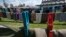 Lines of women's clothing hang, as a part of an art installation called 'Thinking of You,' by Kosovo born artist Alketa Xhafa Mripa, in Pristina stadium, Kosovo, June 10, 2015. 