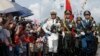 Chinese People's Liberation Army (PLA) soldiers take part in a flag-raising ceremony during the opening day of Stonecutter Island Navy Base in Hong Kong to mark the 19th anniversary of the Hong Kong handover to China, July 1, 2016.