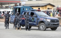 Police stand by during a Democracy Day protest at the Gani Fawehinmi Park, in Ojota, Lagos, Nigeria, June 12, 2021.