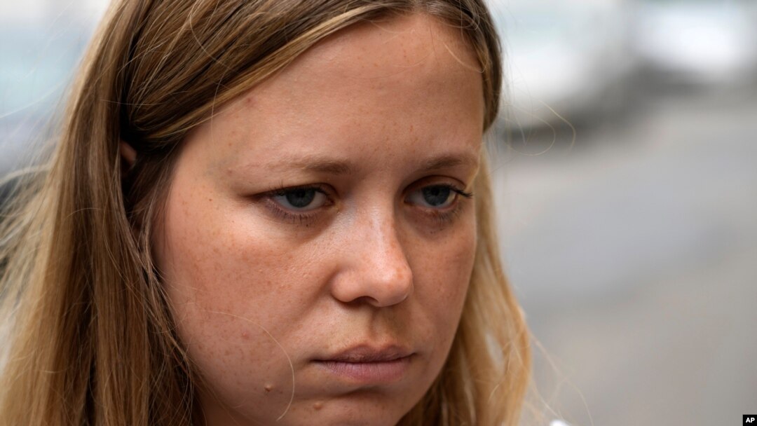 Russian journalist Maria Zholobova enters the police station in Moscow, Russia, June 29, 2021. Russian authorities recently raided homes of several investigative journalists and their family members, amid mounting pressure on Russia's independent media.