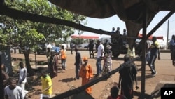 Residents of the mostly Peul suburb of Bambeto, in Conakry, walk back to their homes following the shooting of Abdulai Bah, 20, who died from a gunshot to the neck, 17 Nov 2010