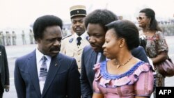 FILE - Gabonese President Omar Bongo and his wife Josephine Bongo, also called Patience Dabany speak with their son Ali (C) as they wait for French president François Mitterrand arrival on January 17, 1983 at Libreville airport.