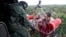 People are airlifted by the Indian Navy soldiers during a rescue operation at a flooded area in the southern state of Kerala, India, Aug. 17, 2018.