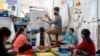 Substitute teacher Julian Consolla is seen with students at Mount Eagle Elementary School, in Alexandria, Fairfax County, Virginia. (Courtesy Donnie Biggs, Fairfax County Public Schools).