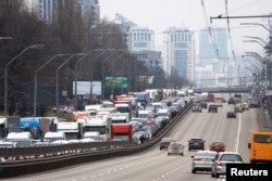 Residents leaving Kyiv are pictured stuck in a highway, after Russian President Vladimir Putin authorized a military operation in eastern Ukraine, Feb. 24, 2022.