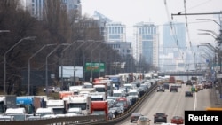 Residents leaving Kyiv are pictured stuck in a highway, after Russian President Vladimir Putin authorized a military operation in eastern Ukraine, Feb. 24, 2022. 