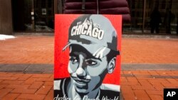 A portrait of Daunte Wright is displayed as a group of demonstrators stand outside of Hennepin County Government Center where former Brooklyn Center Police Officer Kim Potter was sentenced to two years in prison, Feb. 18, 2022 in Minneapolis.