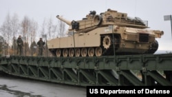 FILE - An M1 Abrams traverses a bridge in Hell, Norway, Oct. 21, during exercise Trident Juncture 2018. (U.S. Navy photo by Senior Chief Mass Communication Specialist Jeffrey J. Pierce)