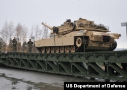 FILE - An M1 Abrams crosses a bridge in Hell, Norway, Oct. 21, 2018, during a military exercise. (U.S. Navy photo)