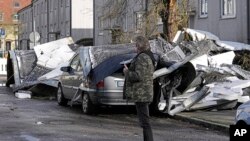 A storm has blown a roof off of an apartment house on a street in Gelsenkirchen, Germany, Feb. 17, 2022. 