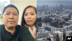 Pasangan WNI Denny Fachry dan Vanda Sakina mengungsi ke kantor Kedutaan Besar RI di Kyiv, pasca serangan Rusia ke Ukraina (dok: VOA/AP)