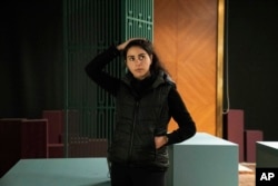 Women's rights activist Najeeba Hayat poses in Kuwait City, Wednesday, February 9, 2022. (AP/Maya Alleruzzo)