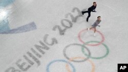 Madison Chock and Evan Bates, of the United States, compete in the team ice dance program during the figure skating competition at the 2022 Winter Olympics in Beijing, China, Feb. 7, 2022. 