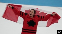 Canada's Jamie Lee Rattray celebrates after defeating the United States in the women's gold medal hockey game at the 2022 Winter Olympics, Feb. 17, 2022, in Beijing.