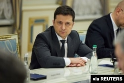 Ukrainian President Volodymyr Zelenskyy meets with leaders of parliament fractions and groups in Kyiv, Ukraine, Feb. 22, 2022. (Ukrainian Presidential Press Service/Handout via Reuters)