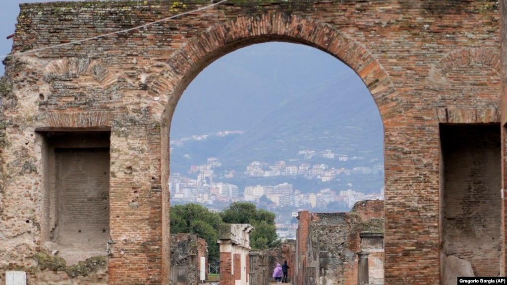 Tourists walk inside the Pompeii archaeological site in southern Italy, Feb. 15, 2022. (AP Photo/Gregorio Borgia)