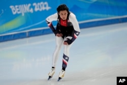 FILE- Brittany Bowe of the United States reacts after her heat in the women's speedskating 1,500-meter race at the 2022 Winter Olympics, Monday, Feb. 7, 2022, in Beijing.