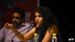 FILE - Indian journalist and author Rana Ayyub speaks in New Delhi, May 27, 2016. In February 2022, United Nations-appointed independent rights experts called on Indian authorities to stop harassment against Ayyub. 