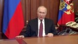 Russian President Vladimir Putin delivers a video address announcing the start of the military operation in eastern Ukraine, in Moscow, in a still image taken from video footage released Feb. 24, 2022.