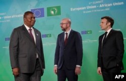 FILE - Central African Republic's President Touadera is welcomed by President of the European Council Charles Michel (C) and French President Macron during an EU-AU summit in Brussels, Feb. 17, 2022. summit in Brussels, Feb. 17, 2022.