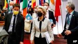 European Commission President Ursula von der Leyen leaves at the end of an EU summit on Ukraine in Brussels, Feb. 25, 2022. 