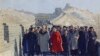 FILE - Then U.S. President Richard Nixon and then first lady Pat Nixon lead the way as they take a tour of China's famed Great Wall, near Beijing, Feb. 24, 1972.