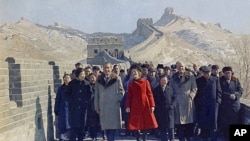 FILE - Then U.S. President Richard Nixon and then first lady Pat Nixon lead the way as they take a tour of China's famed Great Wall, near Beijing, Feb. 24, 1972.