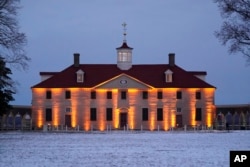 FILE - George Washington's residence is illuminated as President Joe Biden and first lady Jill Biden attend a dinner with members of the National Governors Association in Mount Vernon, Va., Jan. 30, 2022.